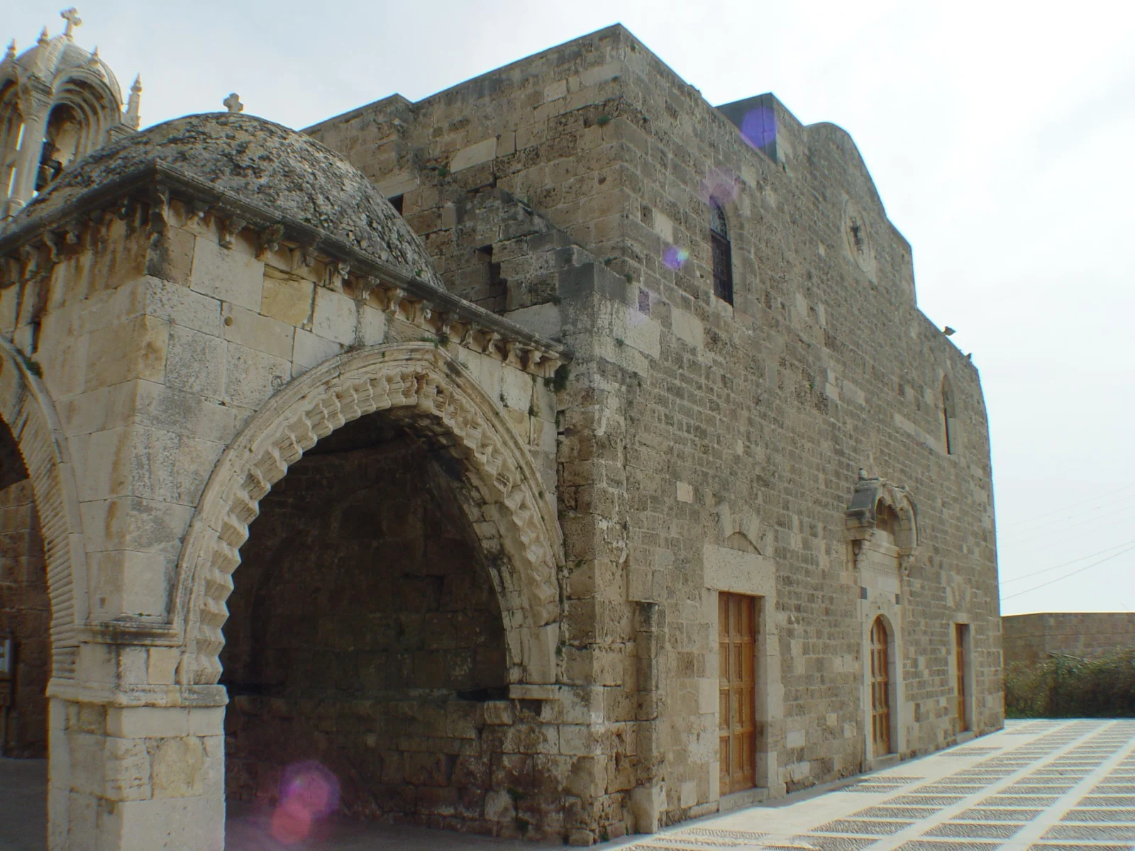The domed baptistery standing against the north wall of the church