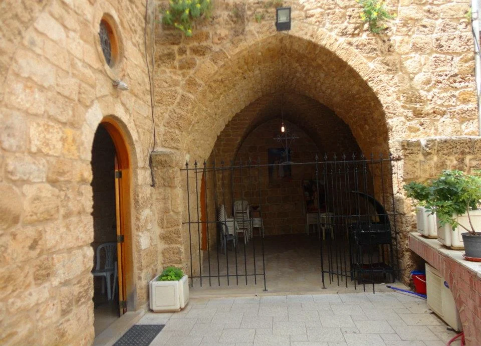A stone arch at the entrance of a church in old Byblos