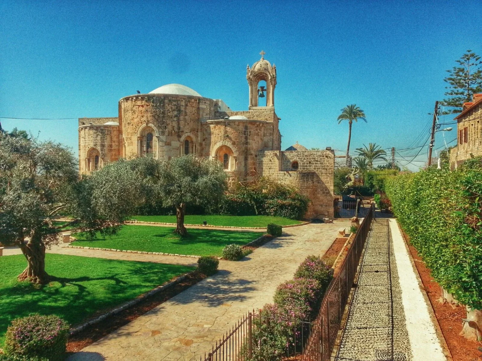 The Church of Saint John Mark and its bell dome, seen from the garden in Byblos